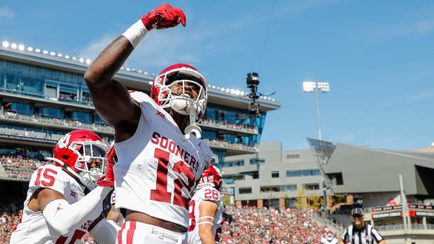 Sep 23, 2023; Cincinnati, Ohio, USA; Oklahoma Sooners defensive back Key Lawrence (12) reacts after intercepting the ball during the first half against the Cincinnati Bearcats at Nippert Stadium. Mandatory Credit: Katie Stratman-USA TODAY Sports
